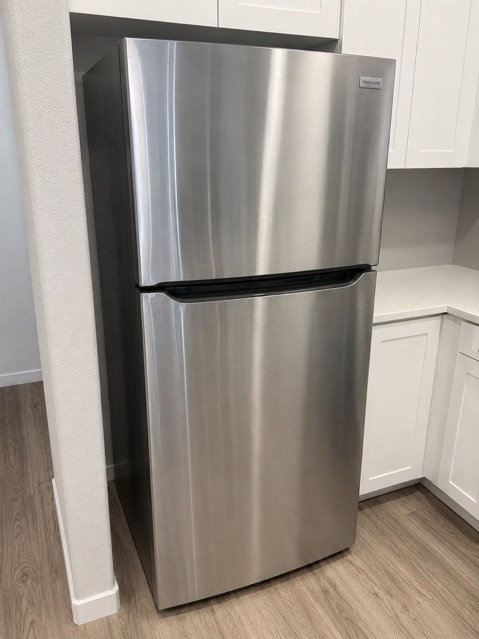 Frigidaire top-freezer refrigerator in a customer's kitchen